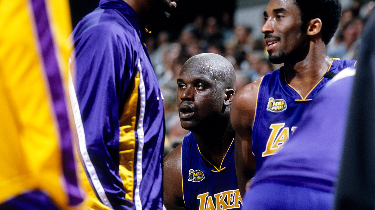 Los Angeles Lakers center Shaquille O'Neal (34) talks to guard Kobe Bryant (8) during a time-out against the Indiana Pacers during the 2000 NBA Finals at Canseco Fieldhouse.