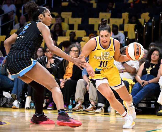 Guard Kelsey Plum #10 of the Los Angeles Sparks drives to the basket past forward Angel Reese #5 of the Chicago Sky in the second half of a WNBA basketball game at Crypto.com Arena in Los Angeles on Sunday, June 29, 2025. (Libby Cline Birmingham, Contributing Photographer)
