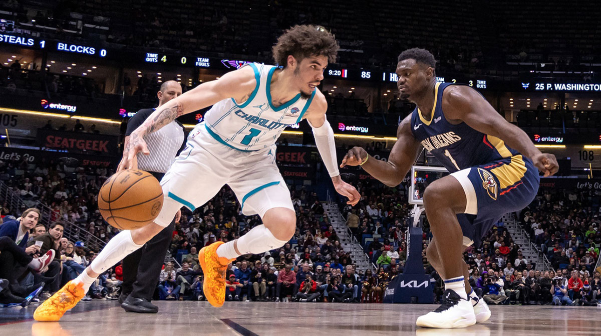 Charlotte Hornets guard LaMelo Ball (1) looses the ball against New Orleans Pelicans forward Zion Williamson (1) during the second half at Smoothie King Center
