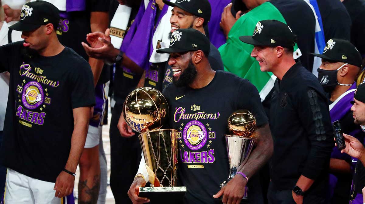 Los Angeles Lakers forward LeBron James (23) smiles while holding the MVP and Finals trophies after game six of the 2020 NBA Finals at AdventHealth Arena. The Los Angeles Lakers won 106-93 to win the series.
