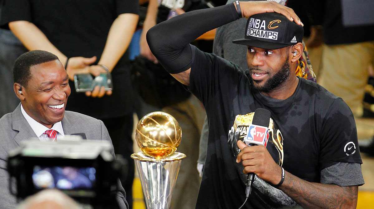 Cleveland Cavaliers forward LeBron James (23) is interviewed by NBA TV analyst Isiah Thomas following the 93-89 victory against the Golden State Warriors in game seven of the NBA Finals at Oracle Arena.