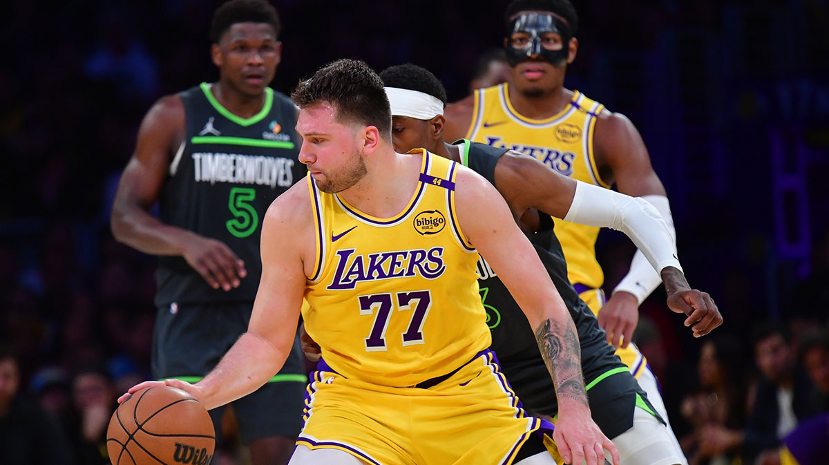 Los Angeles Lakers guard Luka Doncic (77) controls the ball against the Minnesota Timberwolves during the second half in game five of first round for the 2025 NBA Playoffs at Crypto.com Arena.