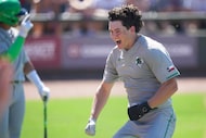 Southlake Carroll center fielder Owen Proksch celebrates after scoring during the first...
