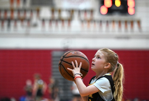 Bennett Nenadal, 7, of Mill Valley takes a shot during...
