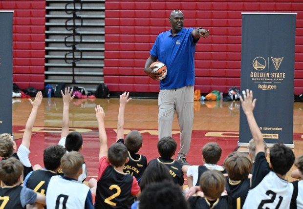 Former Warriors player Adonal Foyle answers questions from kids during...