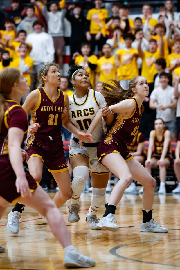 Avon Lake All-Ohioans Olivia Miller (left) and Bre Jones (right) boxes out Ohio Ms. Basketball finalist Tatiana Mason of Brush in the Division III State semifinal in Canton Fieldhouse in Canton on March 11, 2025. (Brian Fisher - For The Morning Journal)
