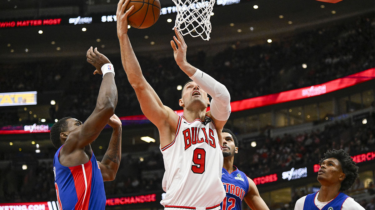 Chicago Bulls center Nikola Vucevic (9) shoots against Detroit Pistons during the first half at the United Center.