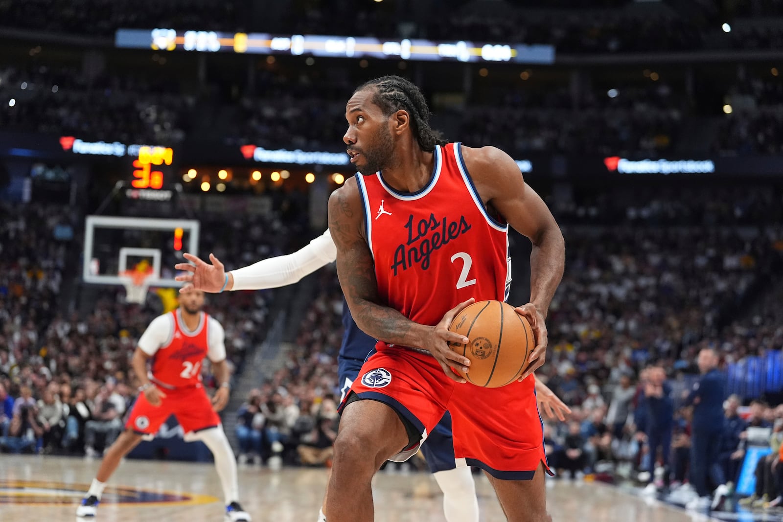 FILE - Los Angeles Clippers forward Kawhi Leonard (2) in the second half of Game 2 of a first-round NBA playoff series April 21, 2025, in Denver. (AP Photo/David Zalubowski, File)