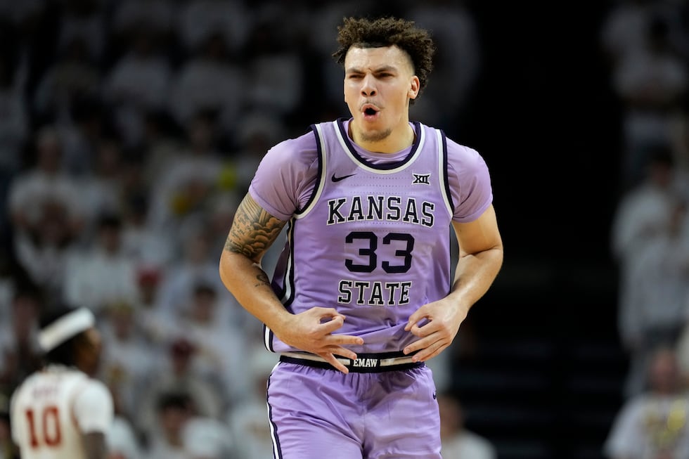 Kansas State guard Coleman Hawkins celebrates after making a three-point basket during the...