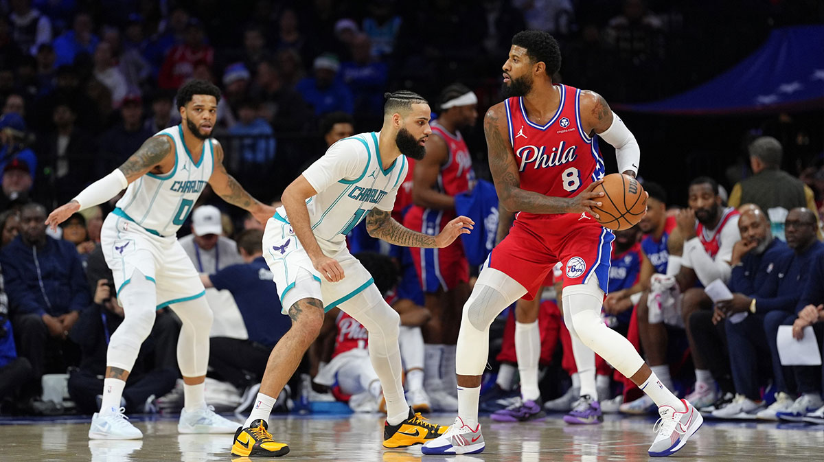 Philadelphia 76ers forward Paul George (8) controls the ball against Charlotte Hornets forward Cody Martin (11) in the second quarter at Wells Fargo Center.