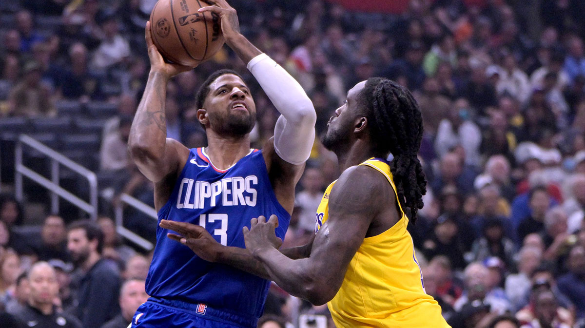 Los Angeles Clippers forward Paul George (13) drives past Los Angeles Lakers forward Taurean Prince (12) in the first half at Crypto.com Arena.