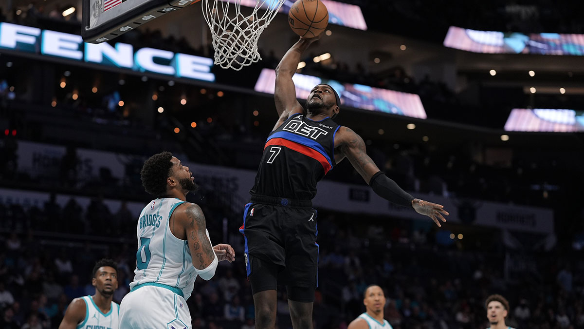 Detroit Pistons forward Paul Reed (7) goes up for a dunk against Charlotte Hornets forward Miles Bridges (0) during the second quarter at Spectrum Center.