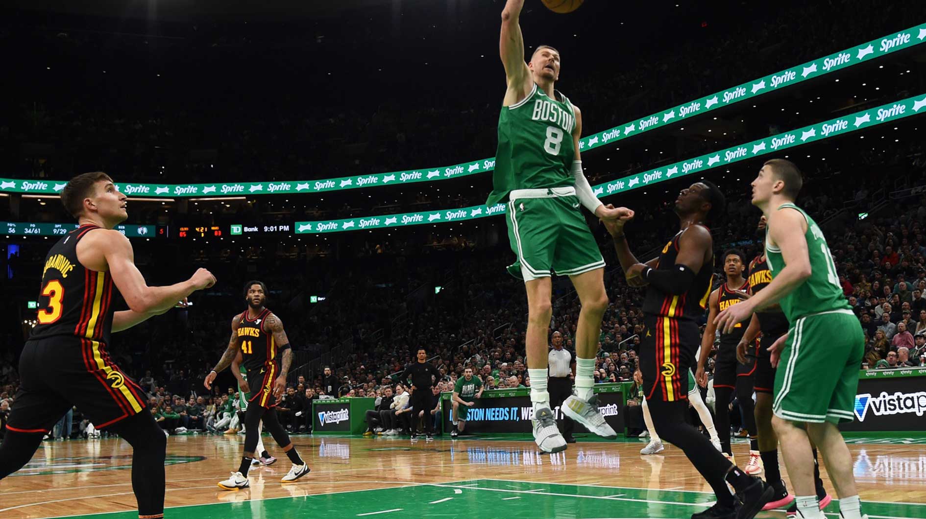 Boston Celtics center Kristaps Porzingis (8) dunks the ball during the second half against the Atlanta Hawks at TD Garden