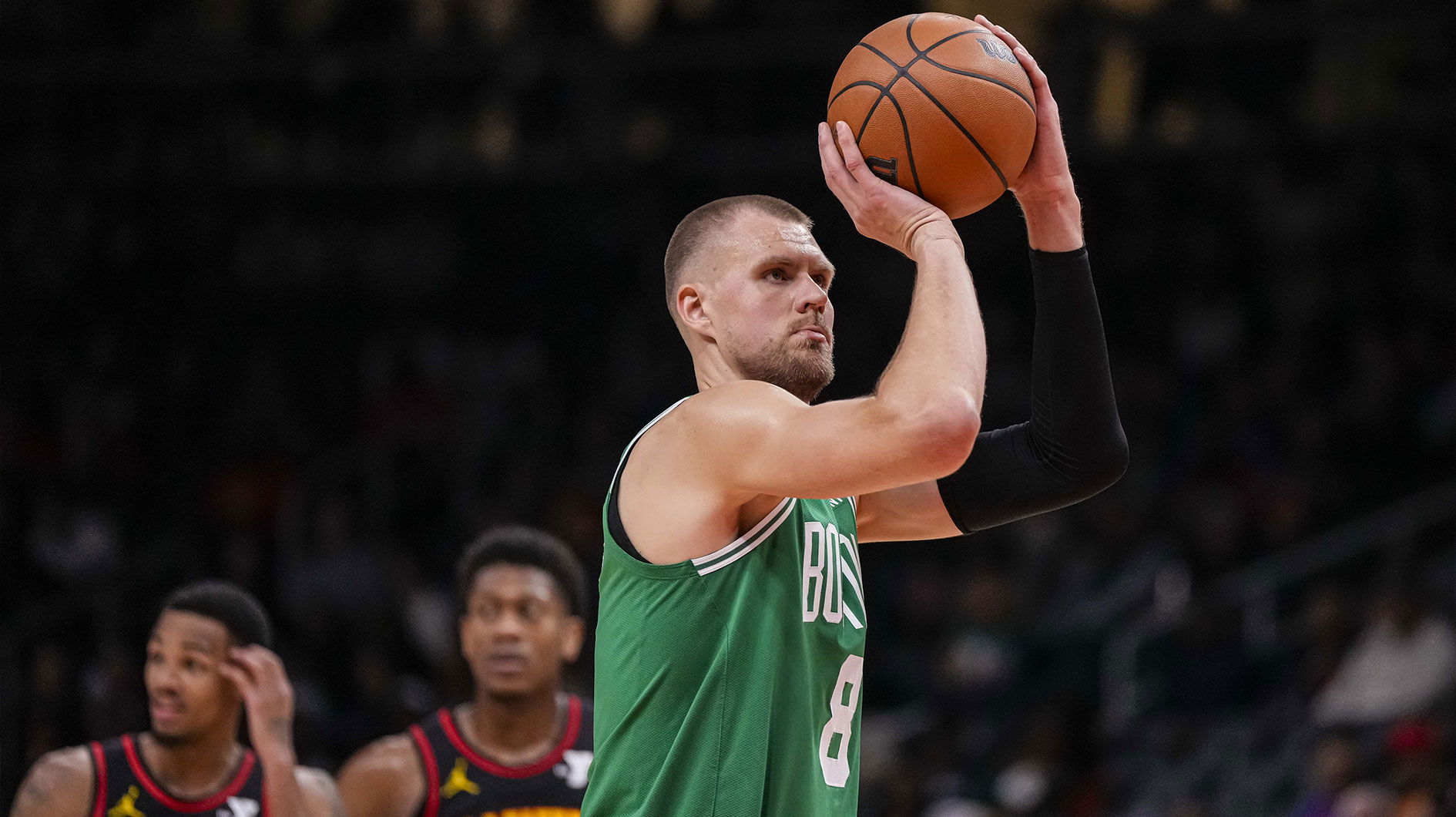 Boston Celtics center Kristaps Porzingis (8) shoots a free throw against the Atlanta Hawks during the first half at State Farm Arena.