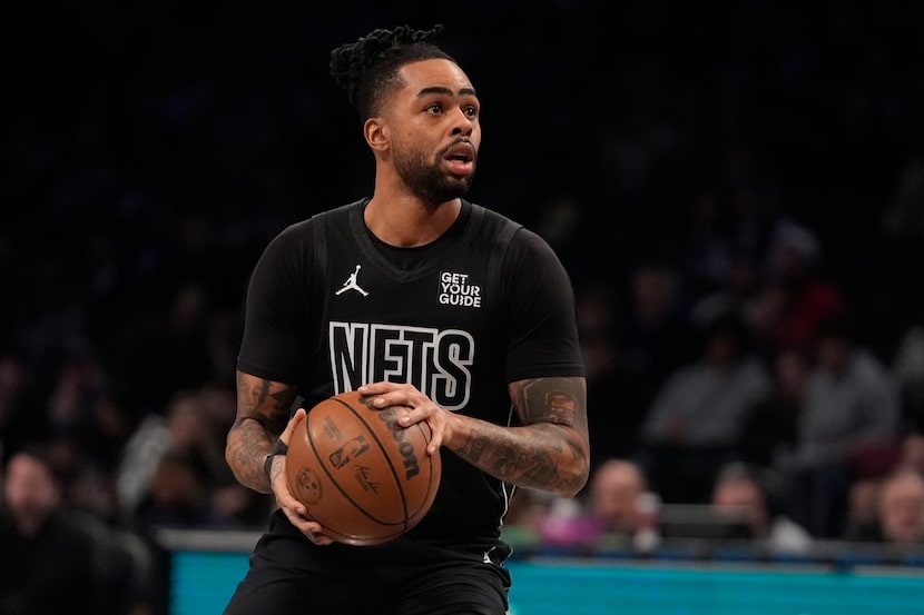 Brooklyn Nets' D'Angelo Russell (1) shoots during the first half of an NBA basketball game...
