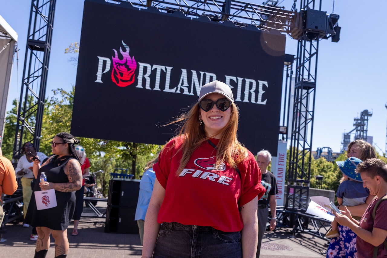 A WNBA fan wears a retro Portland Fire shirt