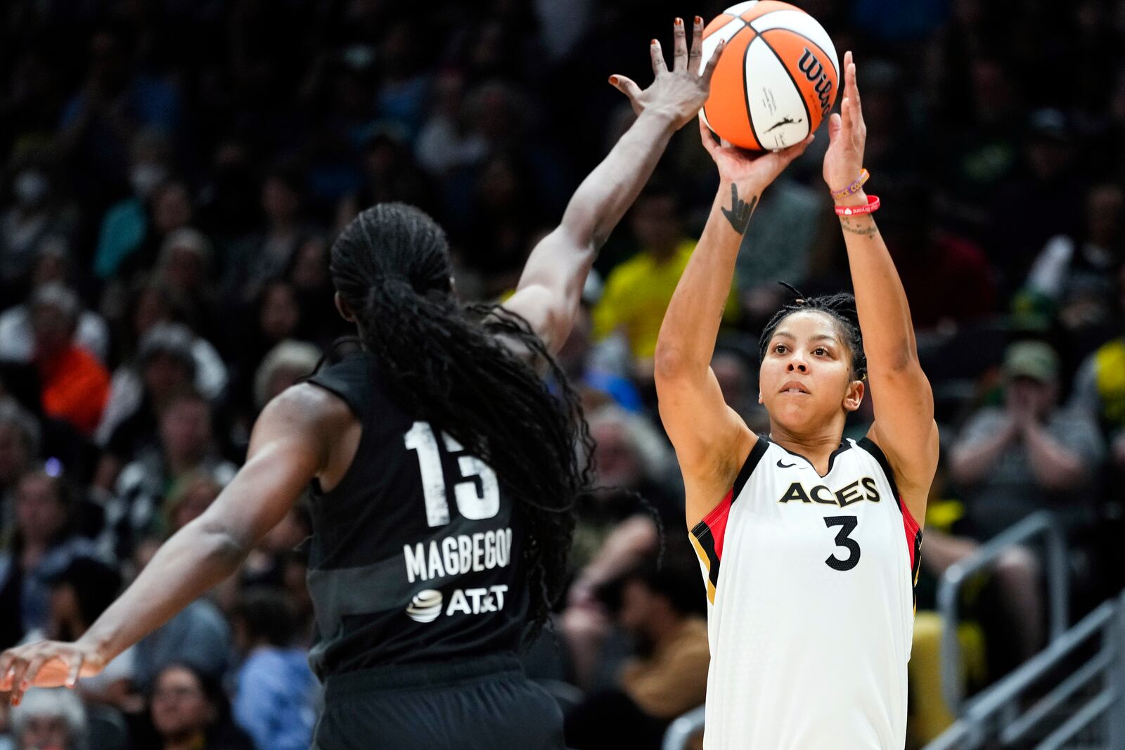 FILE - Las Vegas Aces forward Candace Parker (3) looks to shoot against Seattle Storm center Ezi Magbegor (13) during the second half of a WNBA basketball game May 20, 2023, in Seattle. (AP Photo/Lindsey Wasson, File)
