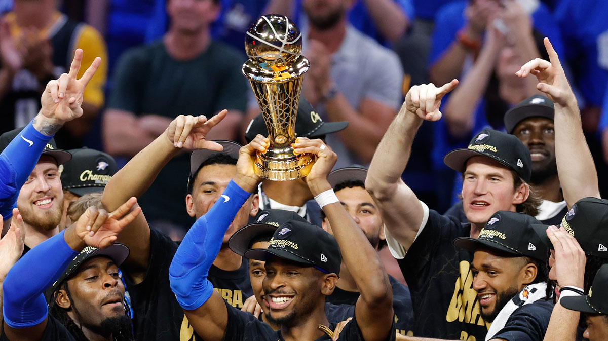 Oklahoma City Thunder guard Shai Gilgeous-Alexander (2) lifts the Larry O'Brien Championship Trophy as the Oklahoma City Thunder celebrate after winning game seven of the 2025 NBA Finals against the Indiana Pacers at Paycom Center.