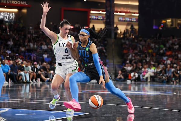 Dream guard Allisha Gray (right) drives against Minnesota Lynx forward Bridget Carleton during Atlanta's recent overtime loss. 