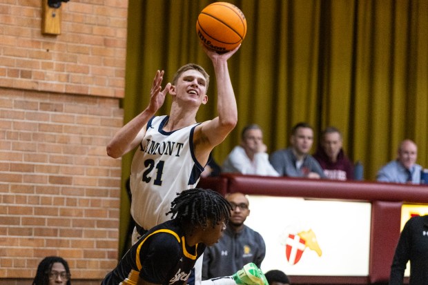 Lemont's Gabriel Sularski (21) leans in for a shot as time expires in the first quarter against Marian Catholic during the Class 3A Brother Rice Sectional semifinals in Chicago on Wednesday, March 5, 2025. (Vincent D. Johnson / for the Daily Southtown)