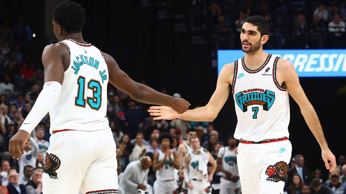 Memphis Grizzlies forward Santi Aldama (7) reacts with forward Jaren Jackson Jr. (13) during the fourth quarter against the Oklahoma City Thunder at FedExForum.