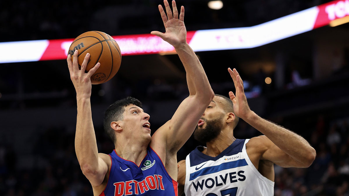 Detroit Pistons forward Simone Fontecchio (19) shoots the ball as Minnesota Timberwolves center Rudy Gobert (27) defends during the second quarter at Target Center.
