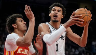 San Antonio Spurs center Victor Wembanyama (1) shoots against Atlanta Hawks Dominick Barlow during the first half of an NBA basketball game, Wednesday, Feb. 5, 2025, in Atlanta. (AP Photo/Mike Stewart)