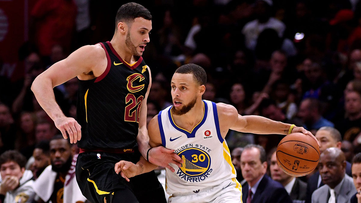 Golden State Warriors guard Stephen Curry (30) handles the ball against Cleveland Cavaliers forward Larry Nance Jr. (22) during the fourth quarter in game four of the 2018 NBA Finals at Quicken Loans Arena.