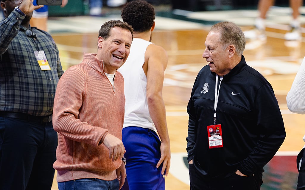 Mat Ishbia, left, and his former college coach Tom Izzo reconnect before the Phoenix Suns play the Detroit Pistons in an exhibition at Michigan State’s Breslin Center recently. (Photo by Brendon Pricco/Cronkite News)
Mat Ishbia, left, and his former college coach Tom Izzo reconnect before the Phoenix Suns play the Detroit Pistons in an exhibition at Michigan State’s Breslin Center recently. (Photo by Brendon Pricco/Cronkite News)