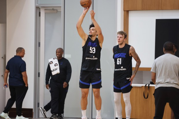 Orlando Magic player Noah Penda (93) shoots during practice at...