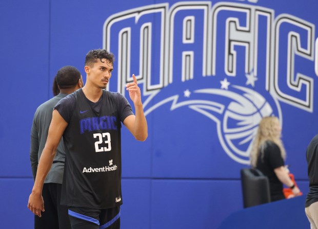 Orlando Magic player Tristan da Silva walks across the court...
