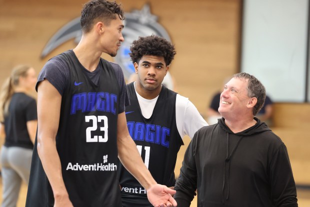 Orlando Magic players Tristan da Silva (23) and Jase Richardson...