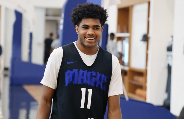 Orlando Magic guard Jase Richardson smiles as he walks to...