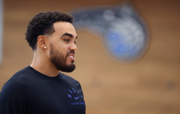 Orlando Magic guard Tyus Jones smiles during a press conference...
