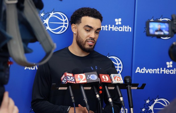 Orlando Magic guard Tyus Jones talks to reporters during a...