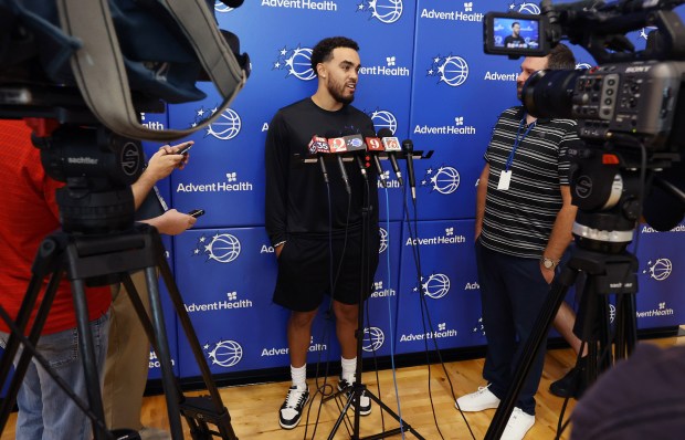 Orlando Magic guard Tyus Jones talks to reporters during a...