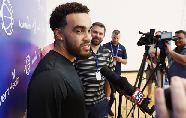 Orlando Magic guard Tyus Jones talks to reporters during a...