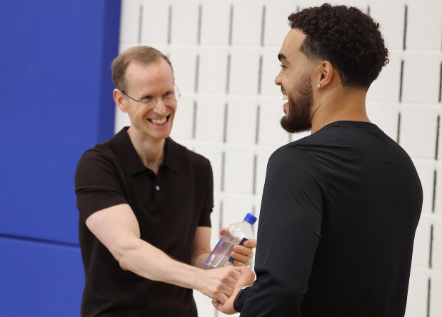 Orlando Magic guard Tyus Jones, right, shares a moment with...
