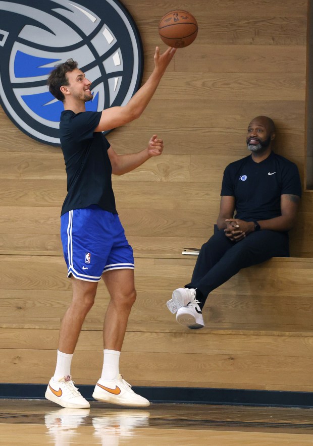 Orlando Magic forward Franz Wagner tosses the ball in front...