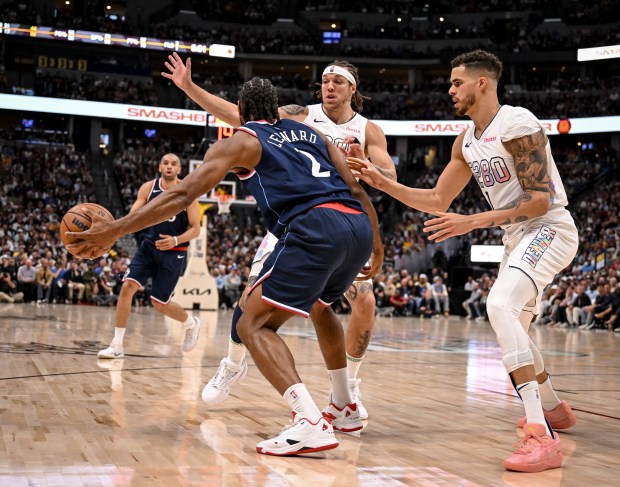 Aaron Gordon (32) and Michael Porter Jr. (1) of the...