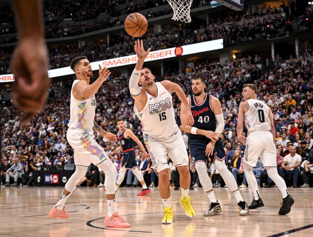 Nikola Jokic (15) of the Denver Nuggets grabs a rebound...