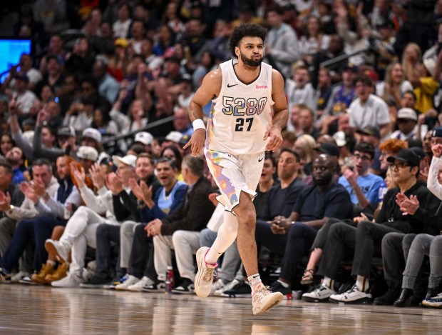 Jamal Murray (27) of the Denver Nuggets puffs his cheeks...