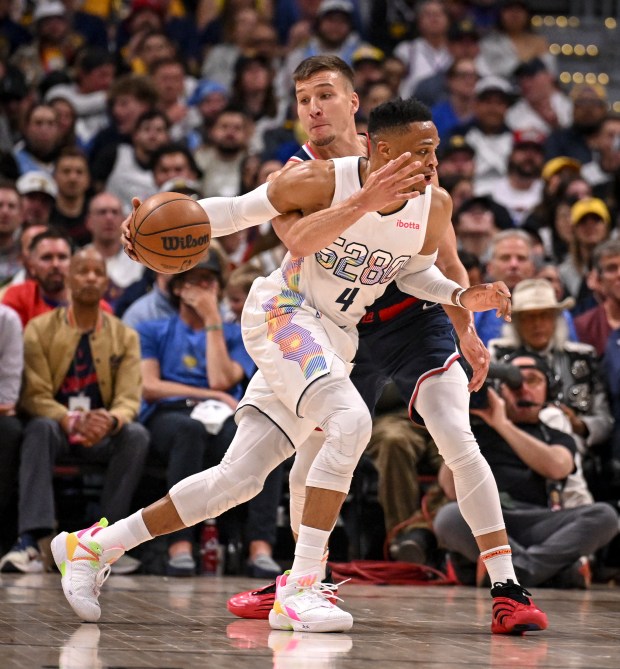 Russell Westbrook (4) of the Denver Nuggets drives as Bogdan...
