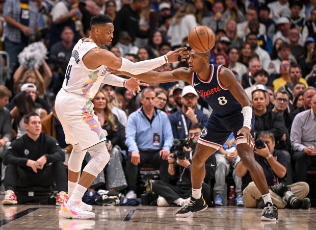 Russell Westbrook (4) of the Denver Nuggets throws a dart...