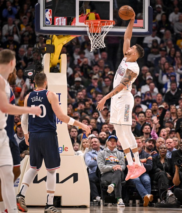 Michael Porter Jr. (1) of the Denver Nuggets dunks as...