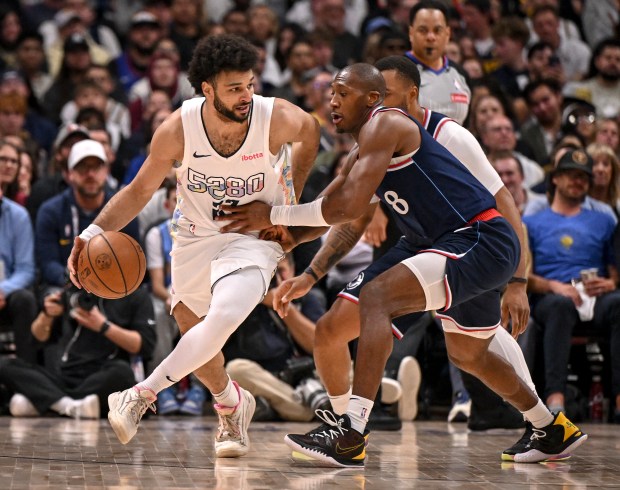 Jamal Murray (27) of the Denver Nuggets handles the ball...