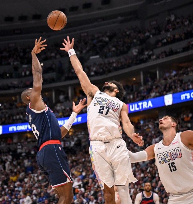 Jamal Murray (27) of the Denver Nuggets defends a shot...
