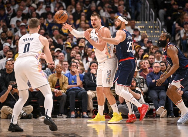 Nikola Jokic (15) of the Denver Nuggets passes to Christian...