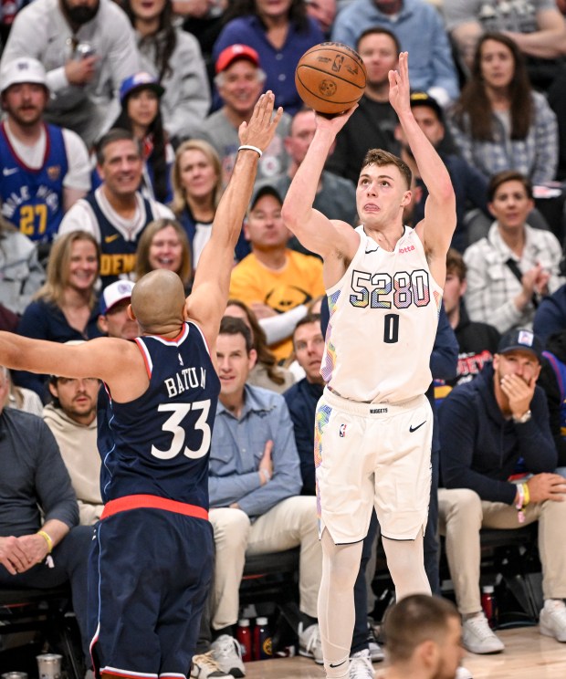 Christian Braun (0) of the Denver Nuggets pulls up and...