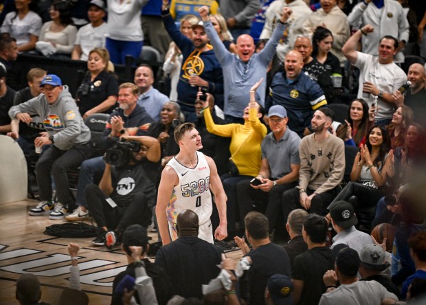 Christian Braun (0) of the Denver Nuggets celebrates making a...